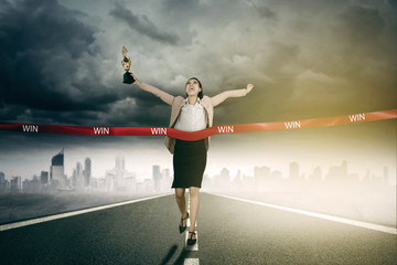 Fototapeta na wymiar Female entrepreneur winning competition