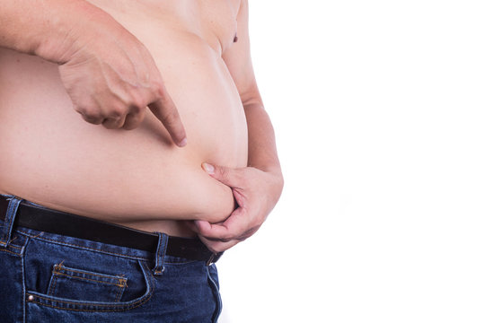 Men pinching unhealthy big belly with visceral or subcutaneous fats