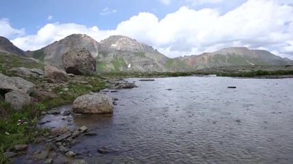 Rain falling on a pond in the alpine wilderness of southern Colorado