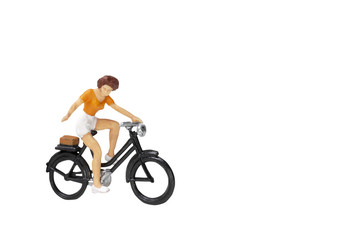 Miniature people travellers with bicycle isolate on white background