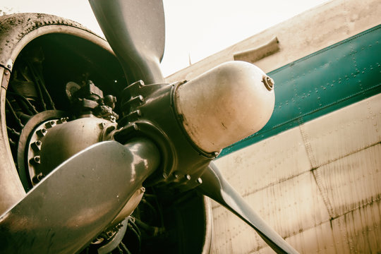 Detail of a vintage abandoned old airplane. Grunge wallpaper background. No people.