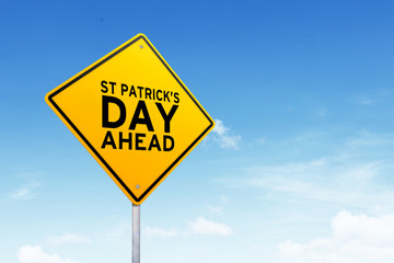 St. Patrick's day is coming road sign shot over beautiful blue sky.