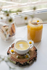 cup of herbal tea with chamomile flowers cozy home tea party concept, countryside still life