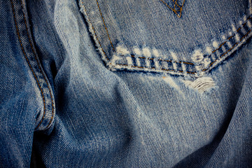 Naklejka premium defective jeans background denim with a seam of vintage fashion design denim texture 