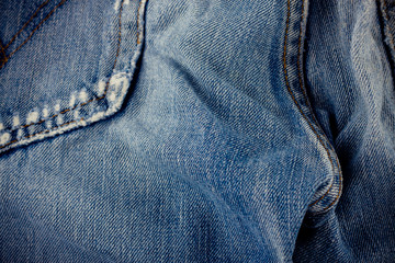 Fototapeta premium brown seam denim and old blue jeans denim texture close up 