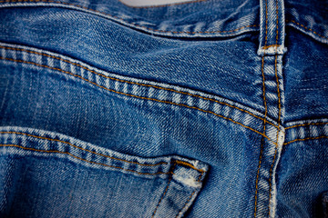 Fototapeta premium old blue jeans seam detail cloth of denim for pattern and classic background close up 