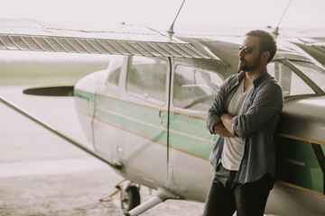 Young pilot checking ultralight airplane before flight © BGStock72