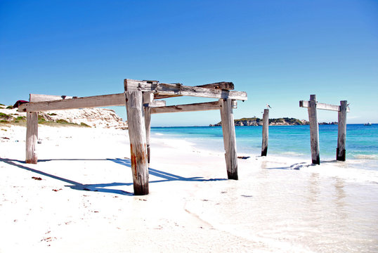 Timber posts in the sand on Hamelin Bay Beach, Western Australia