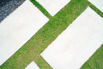 empty concrete desk and green grass background . Blank space for text and images.