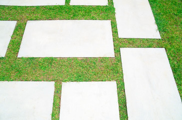 empty concrete desk and green grass background . Blank space for text and images.