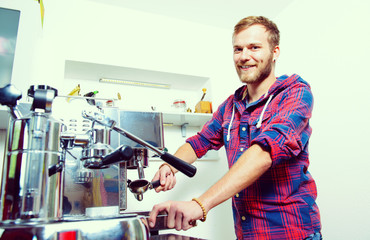 young bearded man with his espresso machine