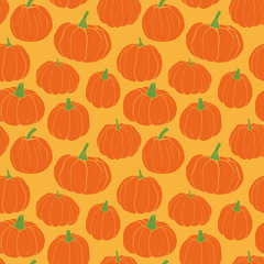 Pumpkins pattern. Autumn seamless vector pattern with hand drawn pumpkins on light yellow background.
