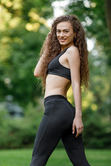 woman doing stretching exercises before running