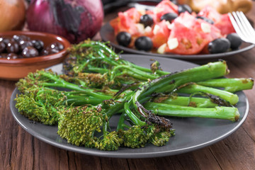 Roasted broccoli on rustic wooden board