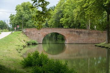 Fototapeta na wymiar Old bridge over the Canal du Midi in Languedoc-Roussillon