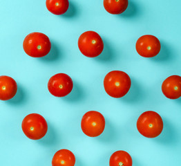 Fresh Cherry Tomatoes on a blue background. Flat lay. Food concept. Pastel shades