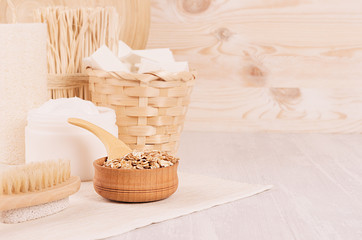 Fototapeta premium Rustic white homemade cosmetics set of natural products for body care and bath accessories in light beige wood interior, copy space.