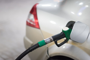 Pumping the fuel diesel or petrol on gas station.