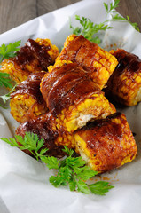 Grilled corn wrapped in bacon