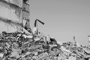 Remains of the destroyed industrial building. Black and white background