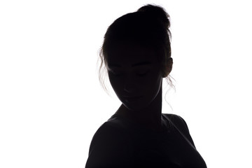 silhouette of young woman head with hairdo on a white isolated background