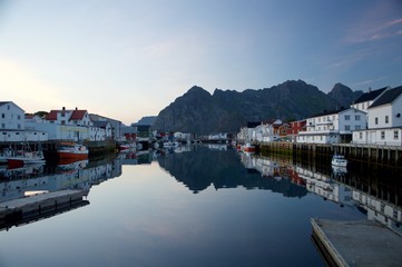 Fototapeta na wymiar The colorful arctic village of Henningsvaer with its famous reflections in Norwegian Lofoten islands, Norway