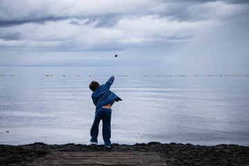 Kid throwing a stone