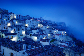 Monte Sant'Angelo town in Foggia, Gargano peninsula in Italy. Night scene with old buildings with...