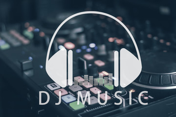 Hands of dj tweak various track controls on dj's deck,selective focus, close up. Dj Music...