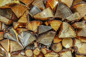 Closeup of a stack of chopped firewood ready for winter image with copy space