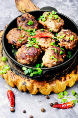 Delicious meatballs in frying pan