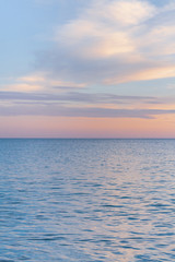 Fototapeta na wymiar Beautiful summer sunset with clouds over the sea