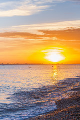 Beautiful summer sunset with clouds over the sea