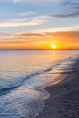 Beautiful summer sunset with clouds over the sea