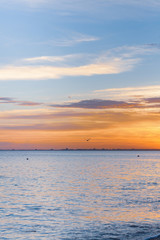 Beautiful summer sunset with clouds over the sea