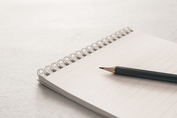 Notepad with clean sheets and a pencil. Close up. Business, education concept. vintage colors