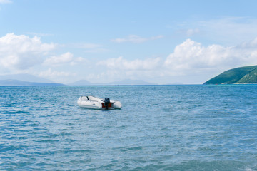 White motor boat on blue ocean