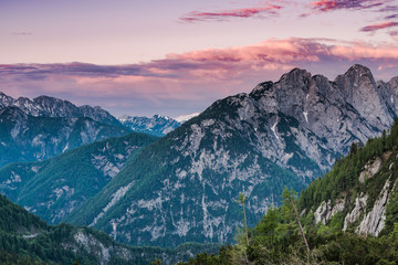 Colorful sunset over high Julian Alps peaks, pink sky