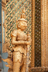 Elegant golden giant guardian statue of Bangkok Grand Palace building - Wat Phra Kaew - Emerald Buddha Temple