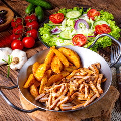 Rustic gyros plate it green salad and potato wedges