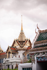 Golden artisan facade and roof of Bangkok Grand Palace 