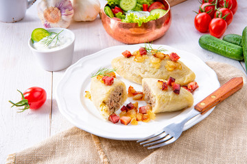 Rustic Cepelinai, a specialty Lithuanian and Polish cuisine.
