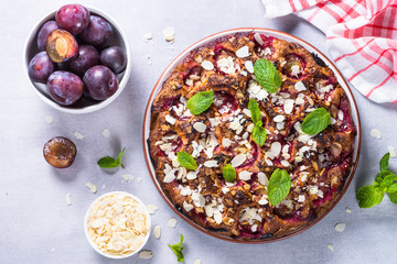 Cake with plums and almond flake.