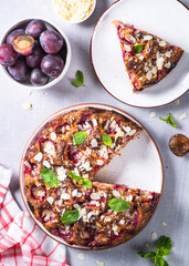 Cake with plums and almond flake.