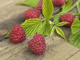 raspberries on a wooden background. 