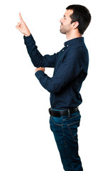 Handsome man touching on transparent screen on isolated white background