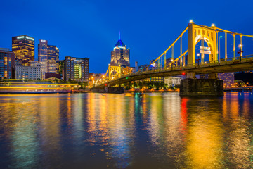 The Roberto Clemente Bridge and Pittsburgh skyline at night, seen from Allegheny Landing, in Pittsburgh, Pennsylvania.