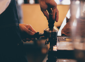 close up barista hand making a cup of coffee.