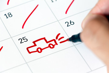 Marking a trip on calendar. Drawing a car. Vacation concept