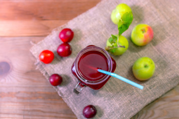 Juice made from apples and plums in a jar